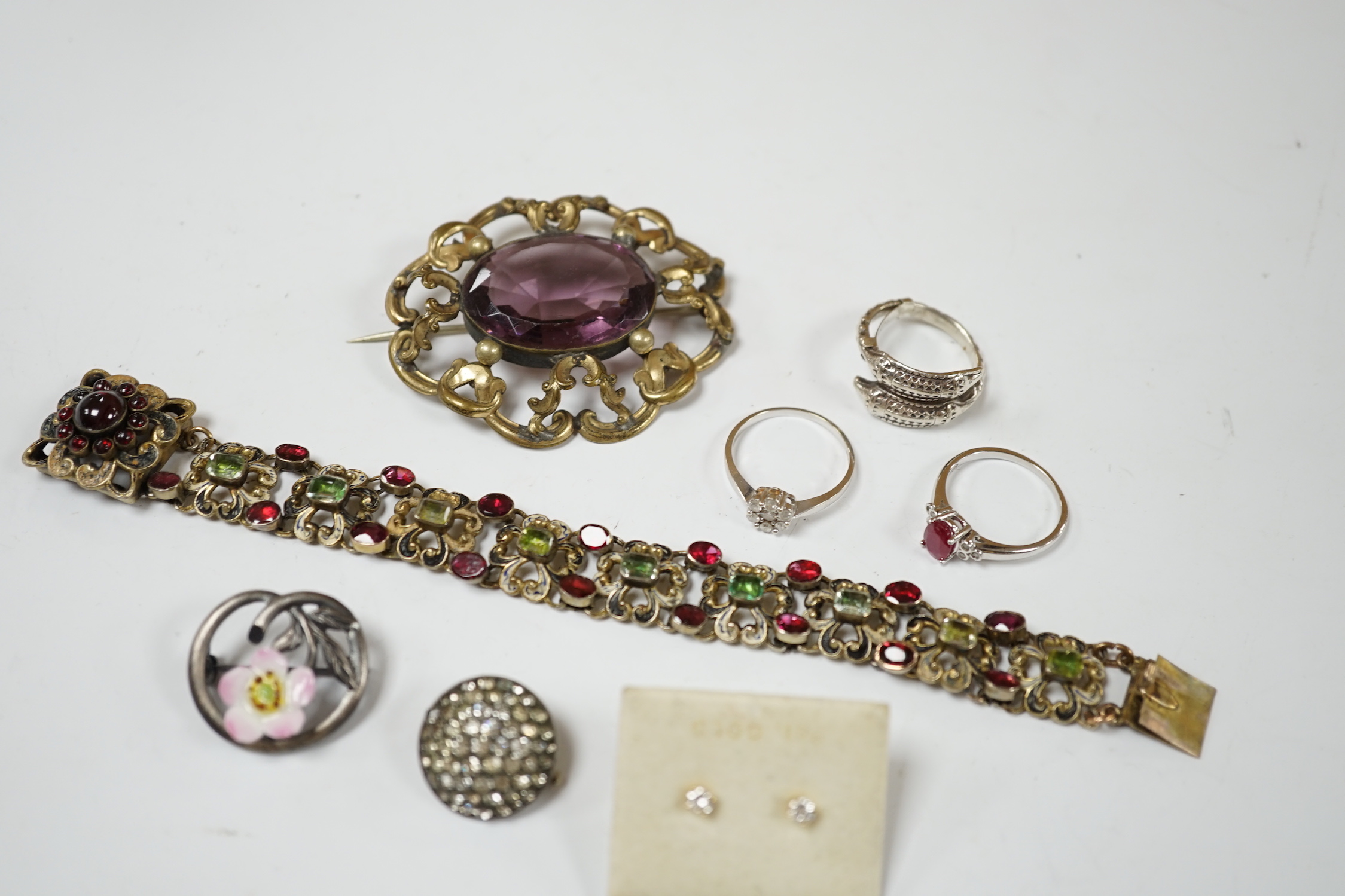 A small pair of diamond stud earrings, two 9ct white gold and gem set rings including diamond cluster and sundry other jewellery including An Austro-Hungarian style bracelet.
